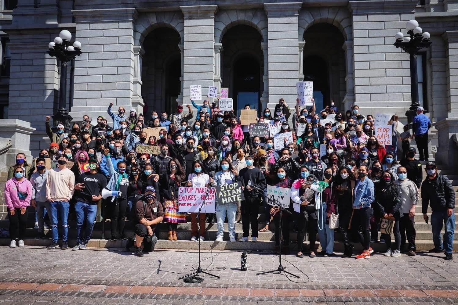 People gathered in front of the Colorado state capitol advocating for an end to racism and violence against Asian Americans and Pacific Islanders