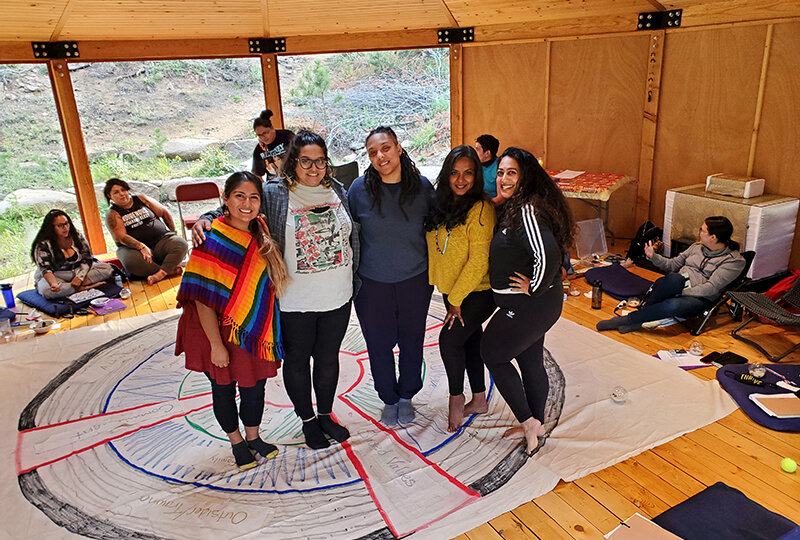 A group of young woman take a break at a leadership retreat